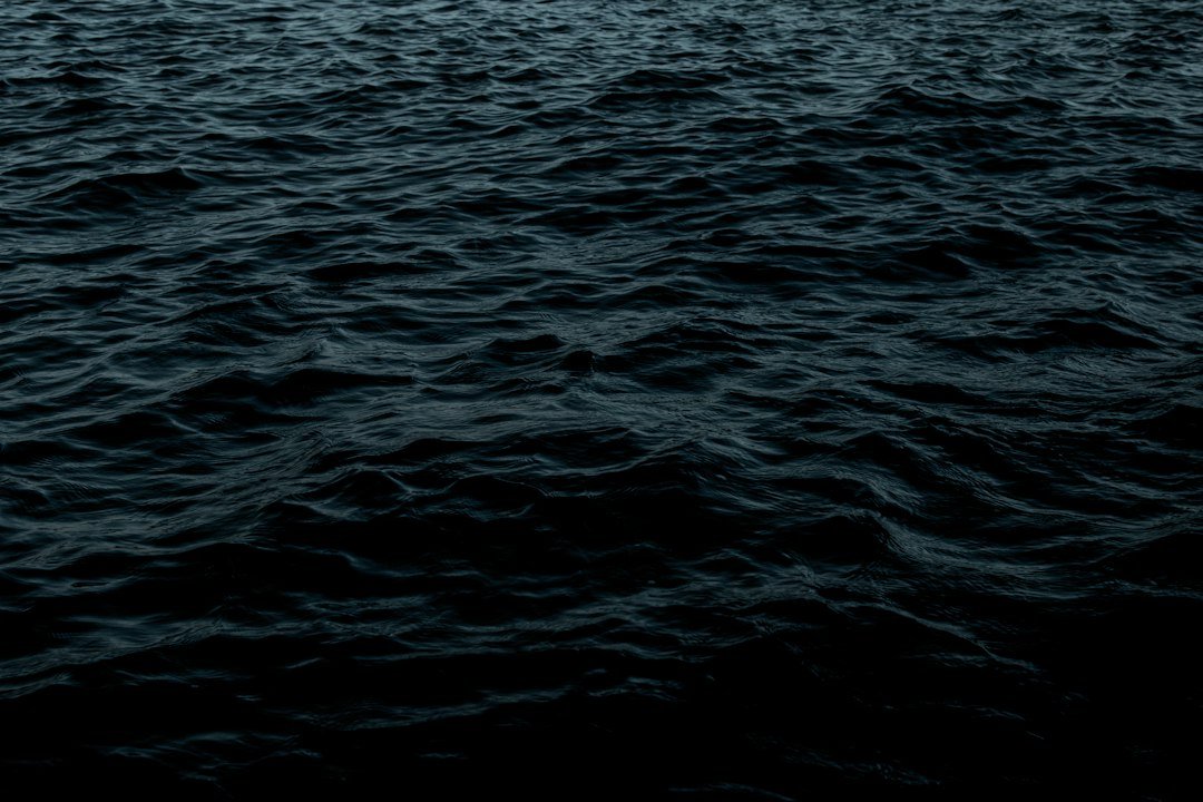 Dark blue ocean waters seen from above, illustrating reports of unexplained objects near the sea; not an actual UFO sighting