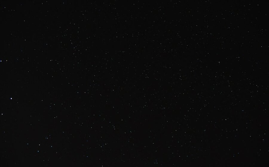Stars in a night sky illustrating UAP questions; not a photograph of a confirmed UFO