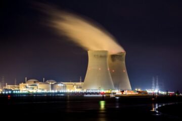 Industrial energy facility at night, illustrative image; not a photograph of a reported drone sighting