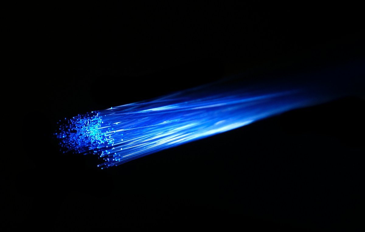 Close-up of illuminated fiber-optic strands symbolizing international undersea internet connections; illustrative photo, not of a damaged submarine cable